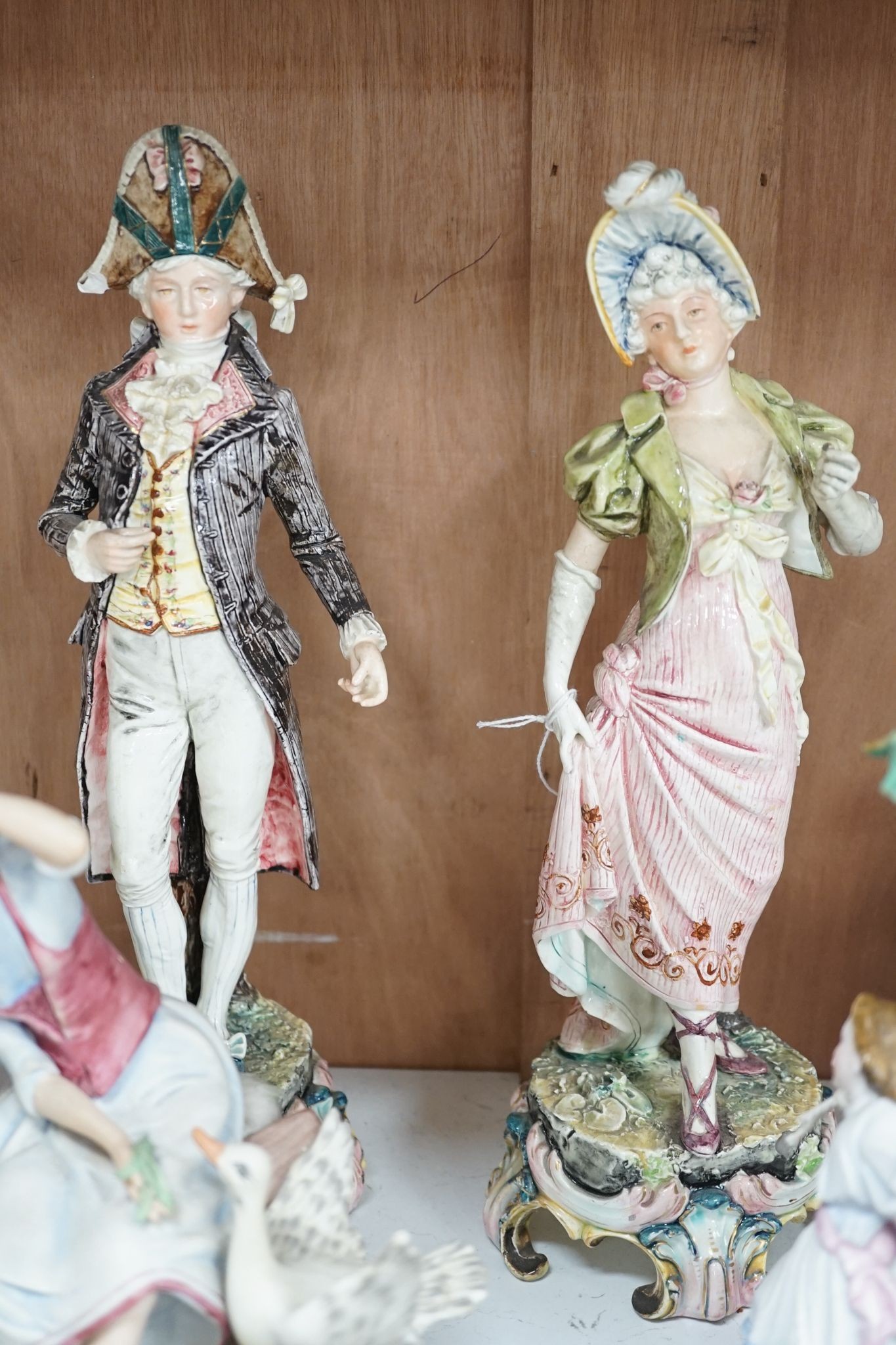 A quantity of various ceramic figures including two Doulton 'Valerie' and 'Meg', tallest figurative candlesticks 34 cms high.